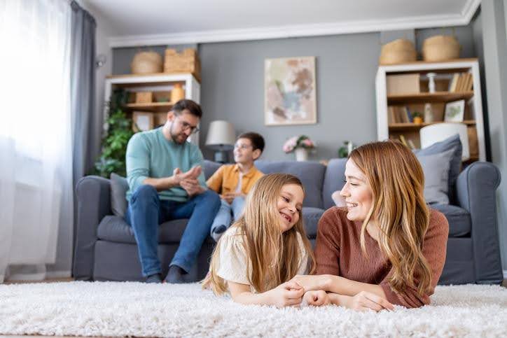 Family enjoying balanced indoor humidity Happy family spending time together in a comfortable, climate-controlled room.