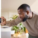 Man maintaining consistent temperature on a device